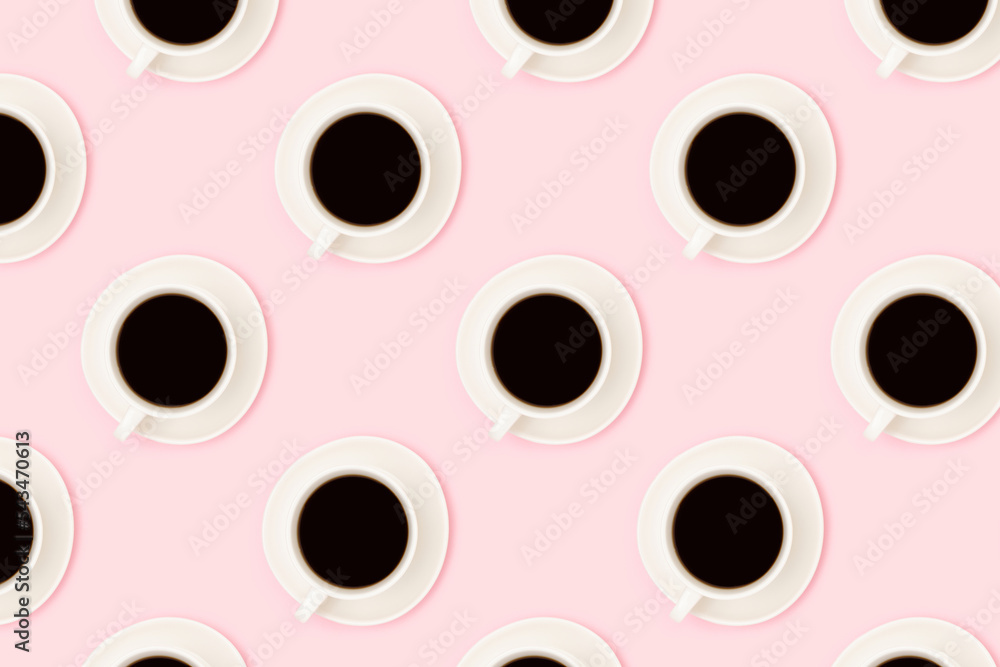 Pattern made of cups with black coffee on a pink background. Creative concept. Pattern made of cups with black coffee on a pink background. Creative concept.