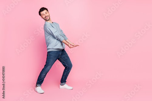 Fototapeta Full body photo of nice young man carry hold empty space banner toothy smiling w