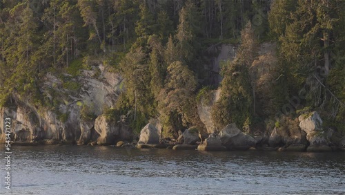 Canadian Nature Landscape on the West Coast of Pacific Ocean. Fall Season Sunny Sunrise. Gabriola near Nanaimo, Vancouver Island, BC, Canada. Background. Slow Motion Cinematic photo