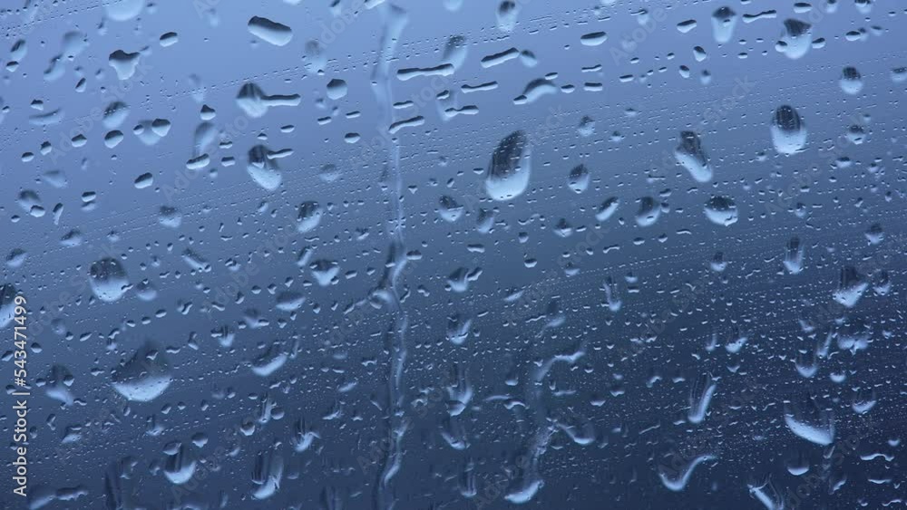 The smeared smudges of raindrops close-up The smeared smudges of raindrops close-up