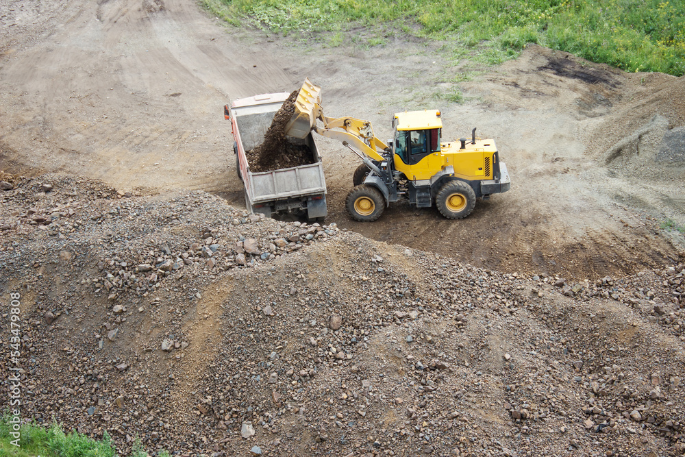 excavator loads crushed stone into dump truck excavator loads crushed stone into dump truck