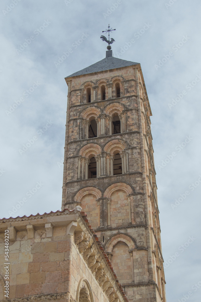 Romanesque tower of the church of San Esteban silhouetted against the sky in Segovia. Spain