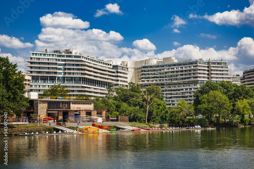 The Thompson Boat Center and Watergate Hotel at the Georgetown waterfront in Washington, DC from the Potomac River during the summer