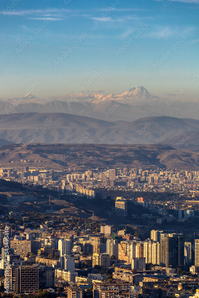 top view of the city of Tbilisi in Georgia and Mount Kazbek on the horizon