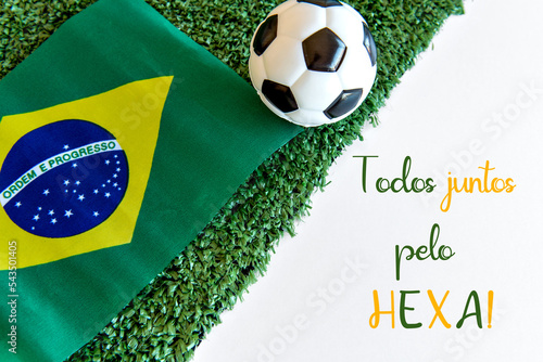 Foto soccer ball and brazilian flag on white background