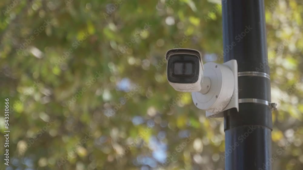 CCTV camera on a black park pole. remote security surveillance system. video security surveillance in public and private area. Big brother is watching. CCTV camera on a black park pole. remote security surveillance system. video security surveillance in public and private area. Big brother is watching.