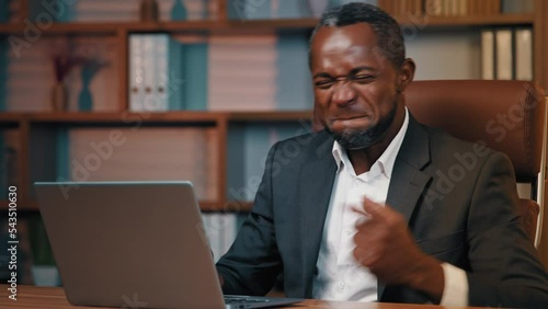 Joyful businessman checking email reading good news on laptop excited happy man leader rejoices in victory celebrating success gets new opportunity great investment proposal achieves desired result