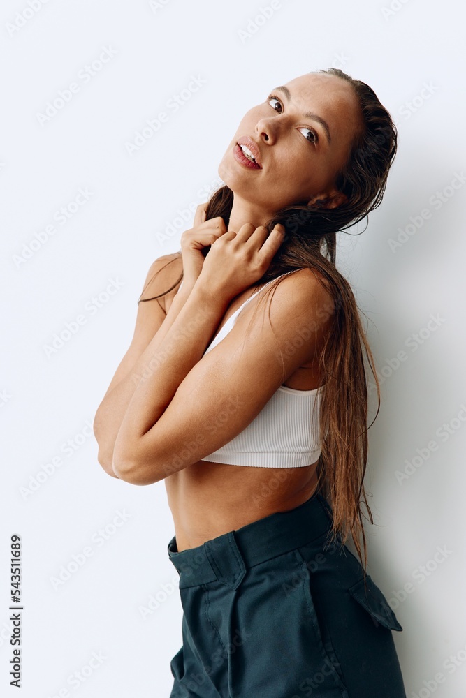 Fototapeta premium A woman with long, wet hair sits with her head tilted back after washing. Taking care of your hair and scalp