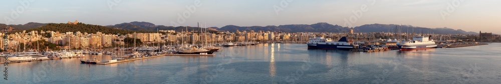 Boats in a Marina with Downtown City Buildings by Balearic Sea. Sunny Sunrise. Palma, Balearic Islands, Spain. Aerial Panoramic View from Cruise Ship.