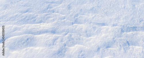The surface of the snow in sunny weather, the snow lies in layers on the surface of the earth