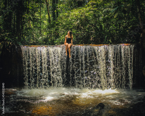 Mulher em cachoeira na selva amazônica,  em Rio preto d eva, Amazonas  photo