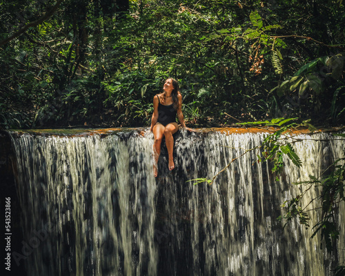 Mulher em cachoeira na selva amazônica,  em Rio preto d eva, Amazonas  photo