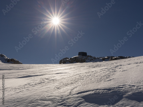 Bright mountain midday sun and hard firn on Dachstein glacier, Austria, Alps