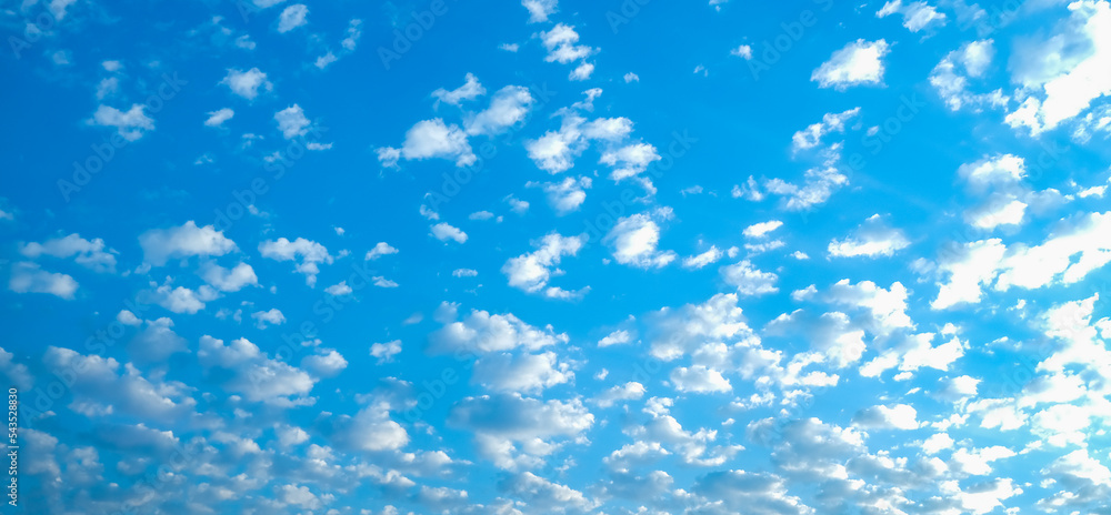 Blue sky with white clouds. Beautiful cloudy sky. Skyward. Endless skyline. The sky at dawn. Banner. Blue sky with white clouds. Beautiful cloudy sky. Skyward. Endless skyline. The sky at dawn. Banner.