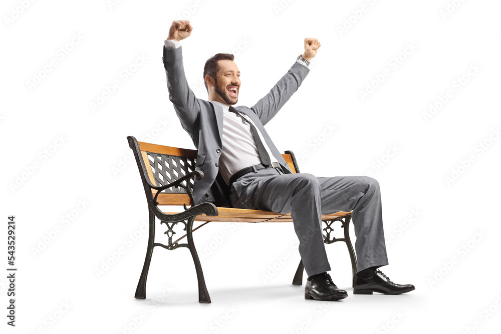 Businessman sitting on a bench and gesturing happiness Businessman sitting on a bench and gesturing happiness