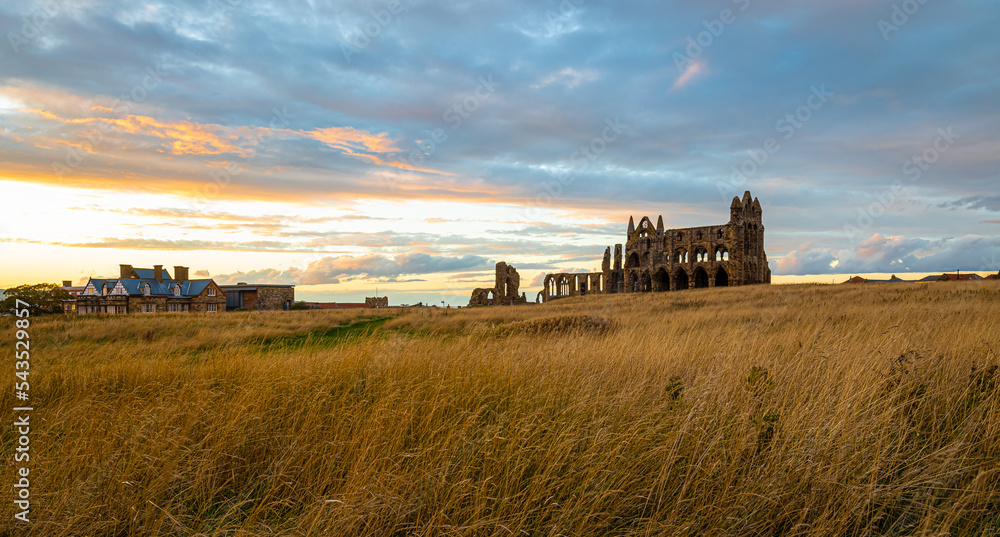 Sunset view of Whitby abbey overlooking the North Sea on the East Cliff above Whitby in North Yorkshire, England