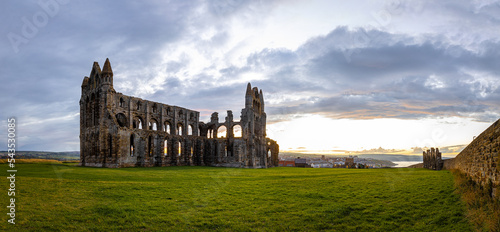 Sunset view of Whitby abbey overlooking the North Sea on the East Cliff above Whitby in North Yorkshire  England
