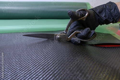 Preparation and cutting of a real carbon fiber sheet for the industrial production of a component for sports cars