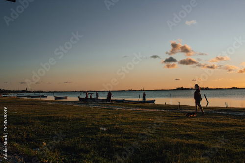 Fishermen at the edge of the pond getting ready to fish