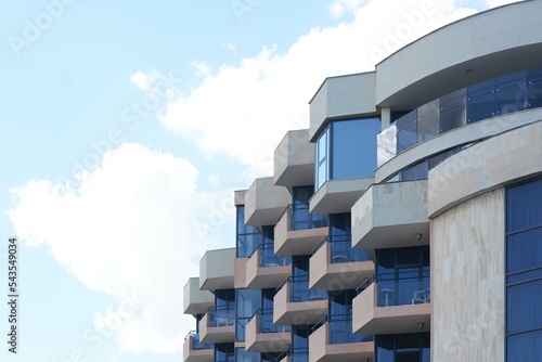 Beautiful building with balconies against sky  low angle view