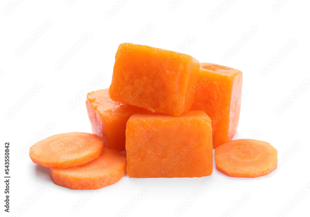 Frozen carrot puree cubes and fresh carrot isolated on white Frozen carrot puree cubes and fresh carrot isolated on white