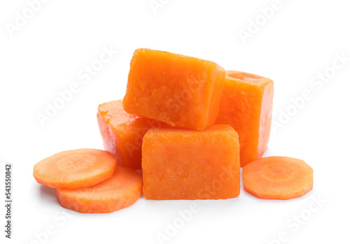 Frozen carrot puree cubes and fresh carrot isolated on white