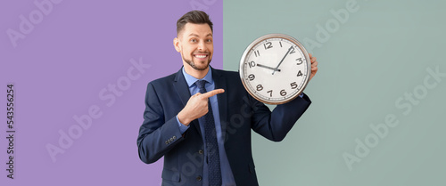 Businessman with clock on c...