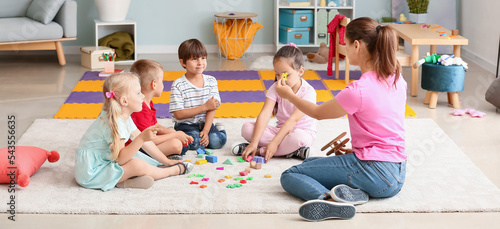 Tableau sur toile Cute little children learning letters in kindergarten
