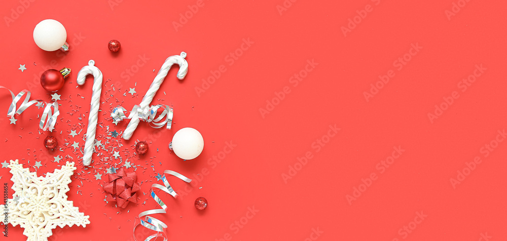 Fototapeta premium Composition with beautiful Christmas decorations on red background with space for text