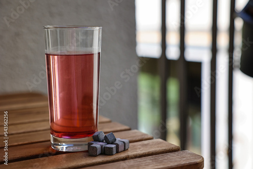 Refreshing red drink in gla...