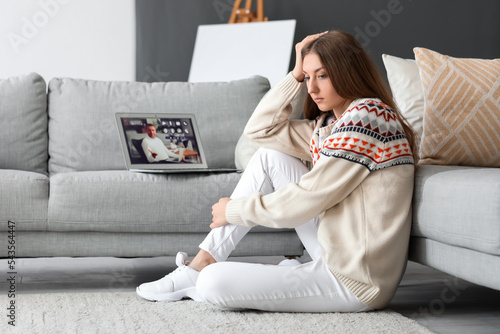 Upset young woman video cha...