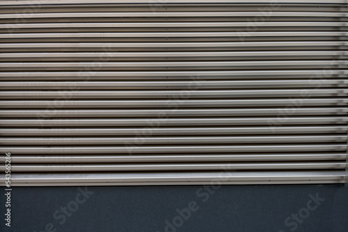 Closeup metal ventilation grille horizontal divisions background
