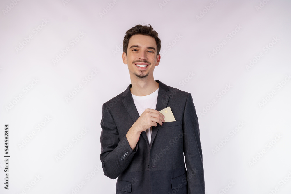 Portrait of Young smiling handsome businessman showing credit card isolated over white background Portrait of Young smiling handsome businessman showing credit card isolated over white background