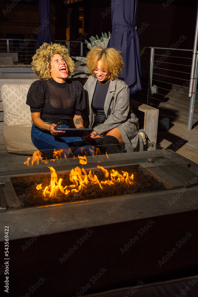 African-American Sisters with Blonde Afros Out at Night