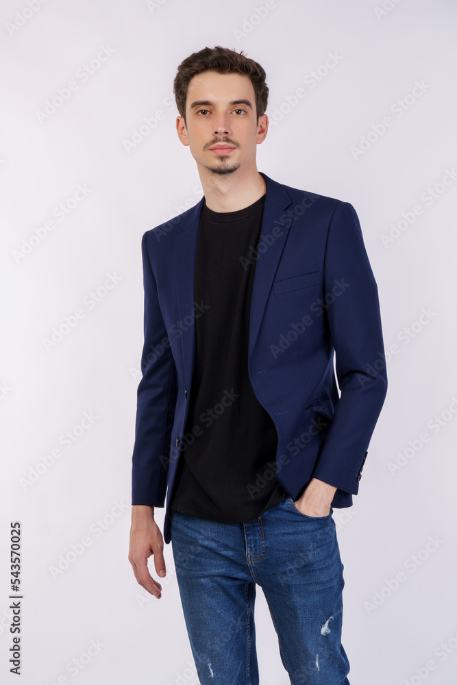 Portrait of happy handsome young man in suit posing on isolated background Portrait of happy handsome young man in suit posing on isolated background