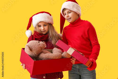 Little children in Santa ha...