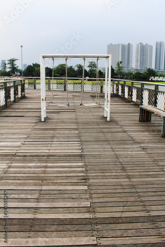 Swing in the middle of the bridge and in the spacious garden with a direct view of the lake photo