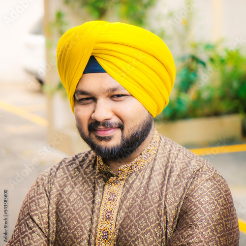 Middle age beard Indian Man posing for the camera