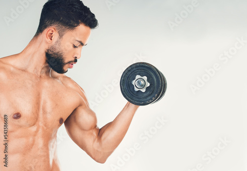 Fitness  muscle and man with dumbbell for weightlifting and body workout  strong and bicep against white studio background. Bodybuilder  weight training and strength endurance in exercise mockup.