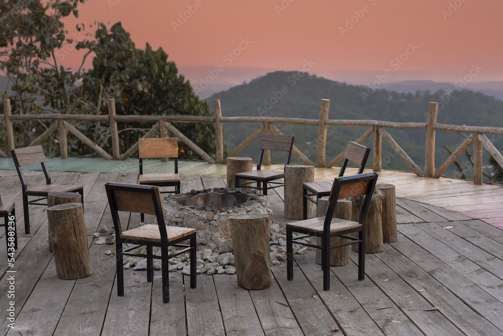 Many chairs and fire place under sunset against mountain view in Da Lat Vietnam