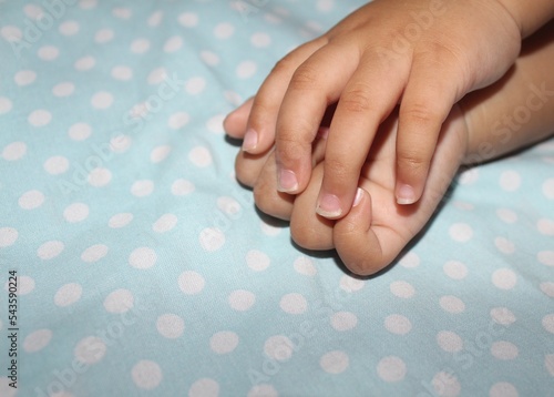 11 month old baby's nails are long, a small part of the nails are broken and there is dirt because they haven't been clipped.