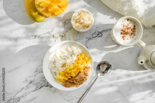 rice porridge with mango on coconut milk