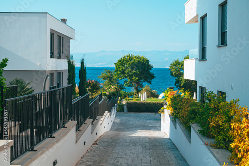 Fototapeta Naklejka Na Ścianę i Meble -  New Modern Hotel Apartment by Mediterranean Sea. Summer in Vacation photo. Blue Sea. Edit Space