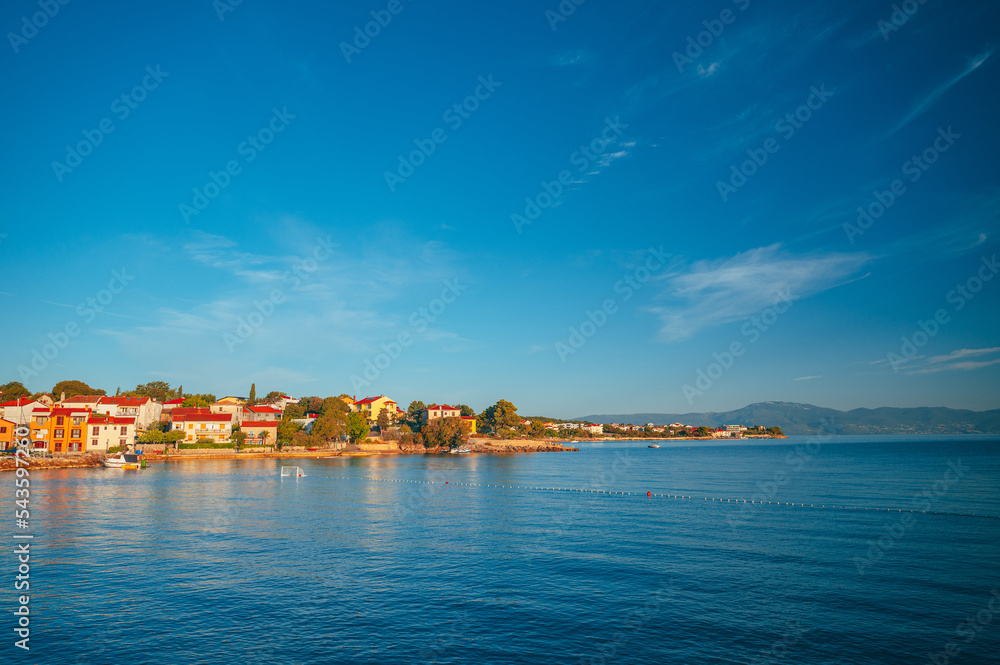 Krk. Town of Malinska harbor and turquoise waterfront panoramic view, Krk island in Croatia