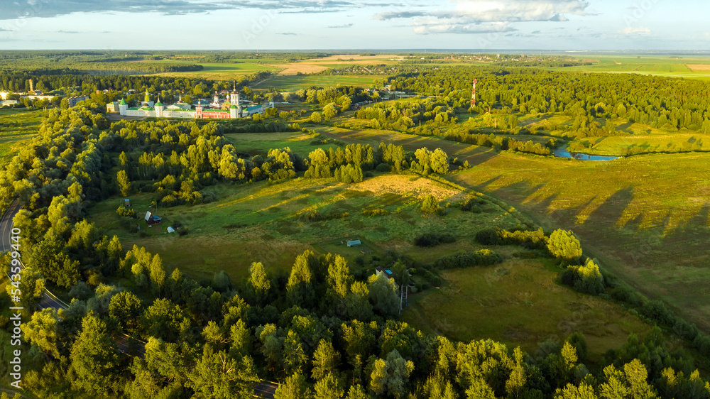Aerial view over the surroundings Nikolo-Peshnoshsky Monastery on a summer evening at sunset
