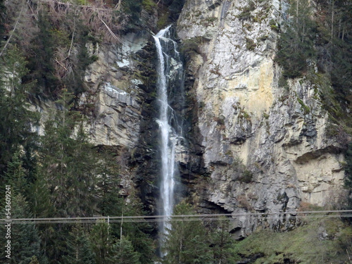 Waterfall on the St. Petersbach or St. Petersbachfall (St. Peters stream waterfall) in the valley of the Swiss Alpine river Vorderrhein, Waltensburg - Canton of Grisons, Switzerland (Kanton Graubünden