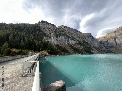 The dam Panixer or concrete dam on the reservoir lake Panixersee (Lag da Pigniu) on the slopes of the Glarus Alps mountain massif, Pigniu-Panix - Canton of Grisons, Switzerland (Schweiz) photo