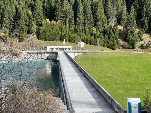 The dam Panixer or concrete dam on the reservoir lake Panixersee (Lag da Pigniu) on the slopes of the Glarus Alps mountain massif, Pigniu-Panix - Canton of Grisons, Switzerland (Schweiz) photo