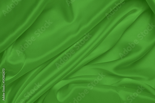 Green silk fabric. Dark emerald silk satin. Suitable for: your design, accessories. Clothes - sari, wedding. Wallpapers and posters. Beleth invitation. You made the right decision. A good choice photo
