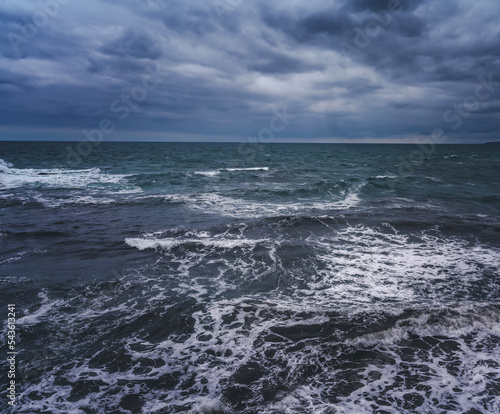 Sea landscape. Storm and waves in overcast cloudy weather